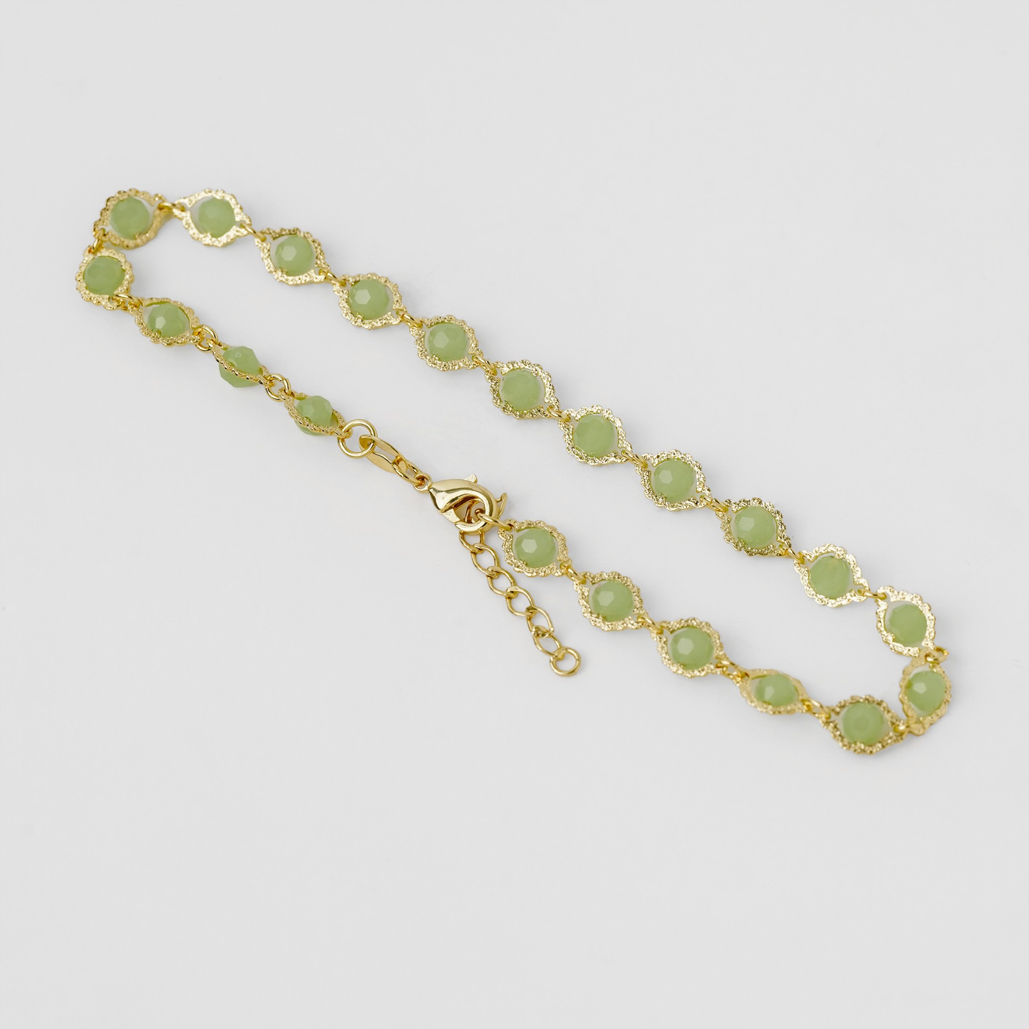 Tobillera Sweet Lemon - piedras verde jade en bezeles dorados